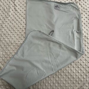 Ollie swaddle in Sky (light blue).